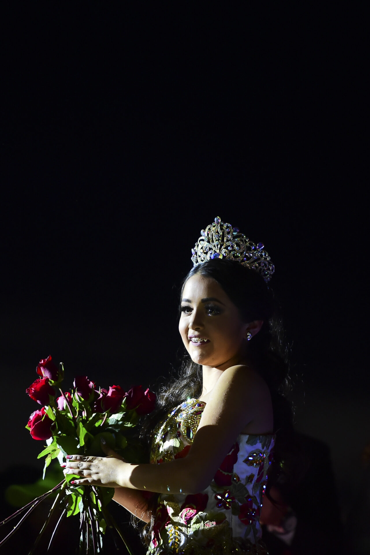 Rubi Ibarra poses during her 15th birthday celebrations in Villa Guadalupe, San Luis Potosi State, on December 26, 2016. Rubi, a small-town Mexican teen, welcomed thousands of guests for her 15th birthday party after her parents' video invitation to the milestone event went viral online. / AFP PHOTO / RONALDO SCHEMIDT