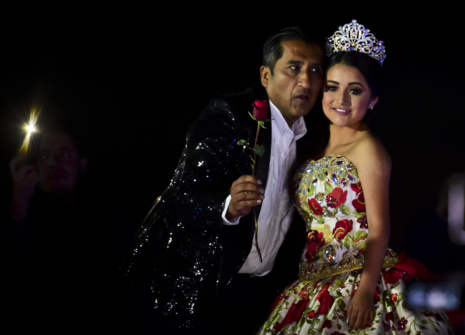 Rubi Ibarra poses during her 15th birthday celebrations in Villa Guadalupe, San Luis Potosi State, on December 26, 2016. Rubi, a small-town Mexican teen, welcomed thousands of guests for her 15th birthday party after her parents' video invitation to the milestone event went viral online. / AFP PHOTO / RONALDO SCHEMIDT