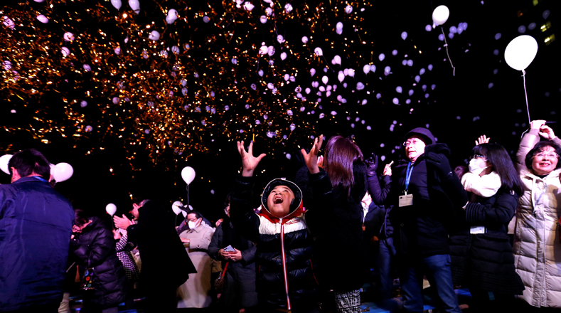 Revellers release balloons as they take part in New Year celebrations in Tokyo, Japan, January 1, 2017. REUTERS/Issei Kato TPX IMAGES OF THE DAY